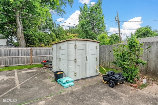 view of shed with a fenced backyard