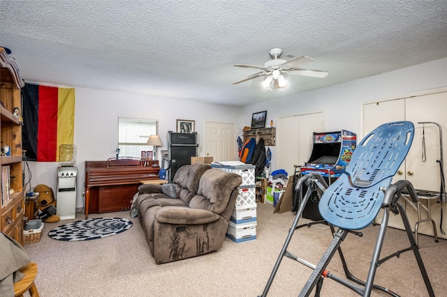425 Headlee St, Denton, TX 76201 - living room with ceiling fan, carpet floors, and a textured ceiling