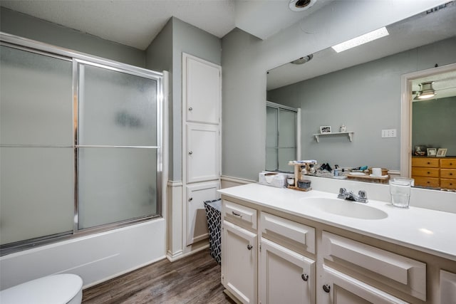 425 Headlee St, Denton, TX 76201 - full bath with wood finished floors, toilet, combined bath / shower with glass door, and vanity