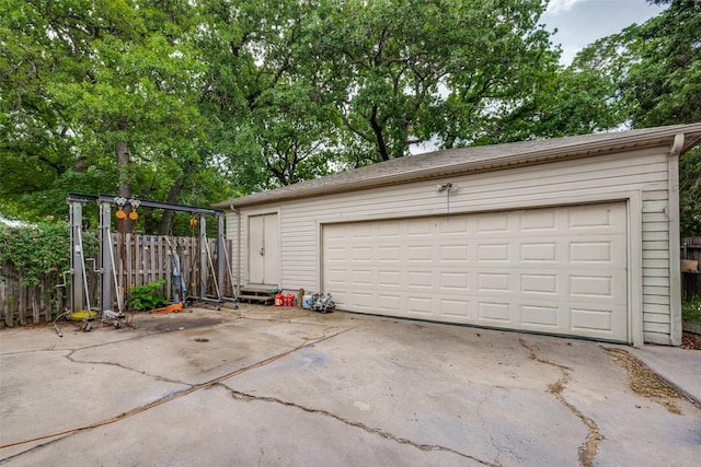 425 Headlee St, Denton, TX 76201 - garage featuring driveway and fence