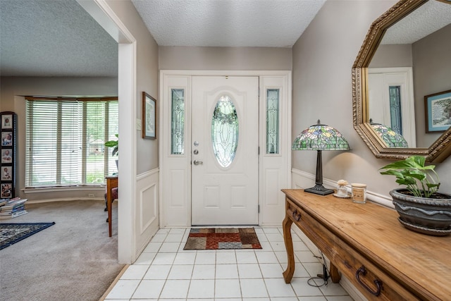 425 Headlee St, Denton, TX 76201 - foyer with a textured ceiling, baseboards, and light tile patterned flooring