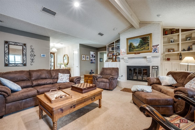 425 Headlee St, Denton, TX 76201 - carpeted living room with a textured ceiling, a brick fireplace, and built in features