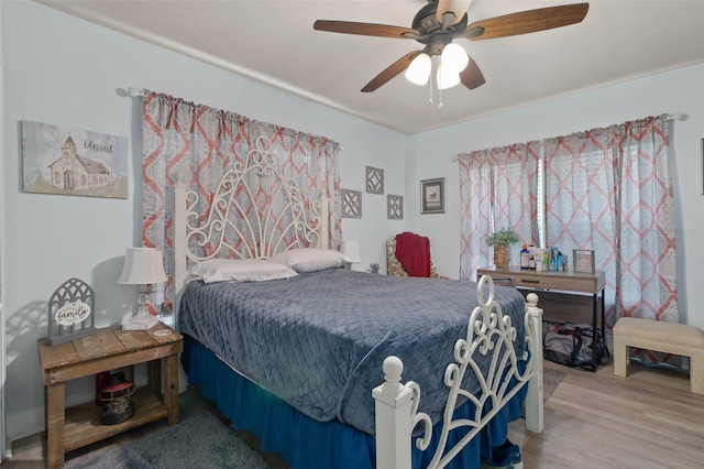211 S Wickham St, Alvord, TX 76225 - bedroom featuring wood finished floors and ceiling fan