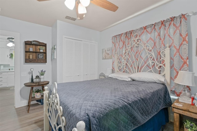 211 S Wickham St, Alvord, TX 76225 - bedroom featuring wood finished floors, a closet, and ceiling fan
