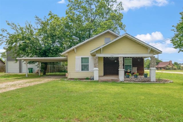 211 S Wickham St, Alvord, TX 76225 - view of front facade with a porch, dirt driveway, and a front lawn