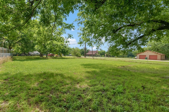 211 S Wickham St, Alvord, TX 76225 - view of yard with a garage and an outbuilding