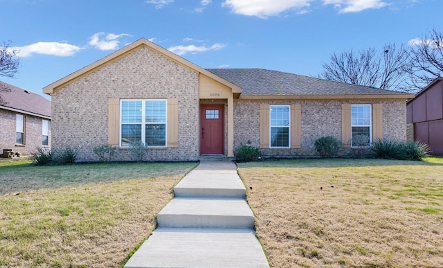 8106 Woodside Rd, Rowlett, TX 75088 - ranch-style home featuring brick siding and a front lawn