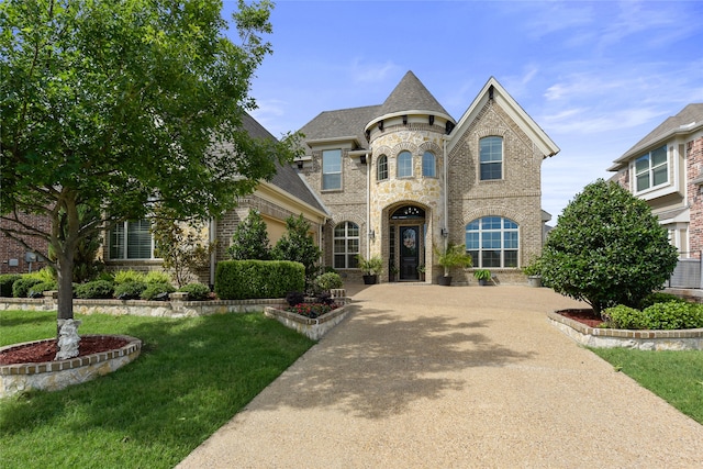 215 Dominion Dr, Wylie, TX 75098 - french country style house featuring brick siding and a front lawn