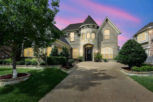 215 Dominion Dr, Wylie, TX 75098 - french provincial home featuring stone siding, brick siding, and a lawn