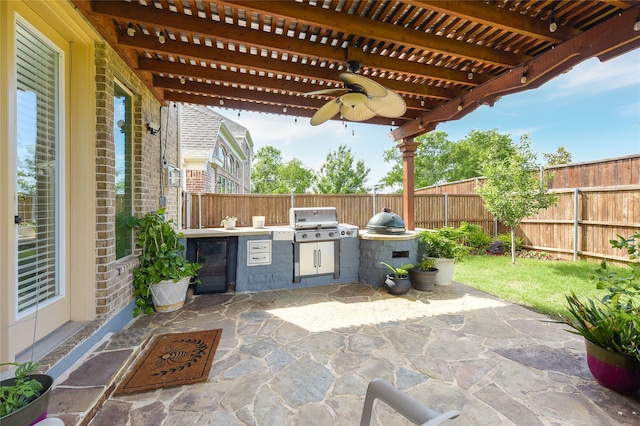 215 Dominion Dr, Wylie, TX 75098 - fenced backyard with ceiling fan, a patio, and wine cooler