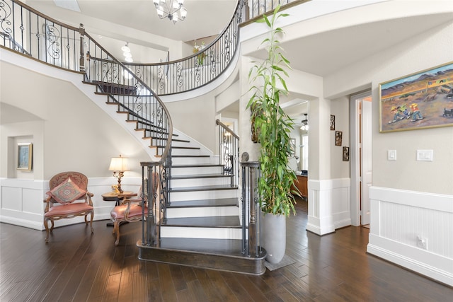 215 Dominion Dr, Wylie, TX 75098 - foyer entrance featuring wainscoting, stairs, hardwood / wood-style floors, and a chandelier