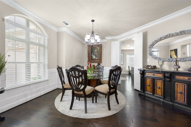 215 Dominion Dr, Wylie, TX 75098 - dining space with a chandelier, crown molding, dark wood-type flooring, and a wainscoted wall