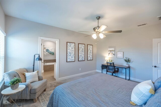 6709 Tradition Dr, Abilene, TX 79606 - bedroom with light carpet, baseboards, ceiling fan, and ensuite bath