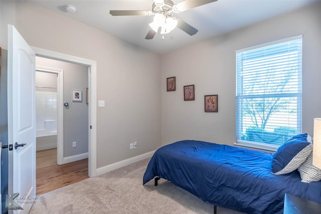 6709 Tradition Dr, Abilene, TX 79606 - bedroom with multiple windows, baseboards, a ceiling fan, and carpet