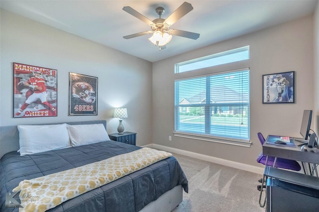 6709 Tradition Dr, Abilene, TX 79606 - bedroom featuring baseboards, light carpet, and ceiling fan