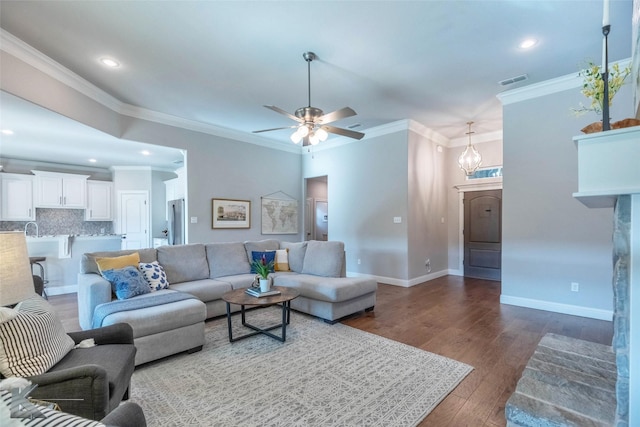 6709 Tradition Dr, Abilene, TX 79606 - living room with ceiling fan, crown molding, wood finished floors, baseboards, and recessed lighting