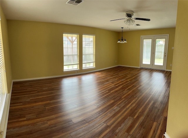 804 Austin Acre, Sulphur Springs, TX 75482 - empty room with dark wood-style flooring, ceiling fan, and baseboards