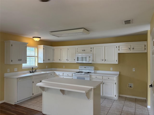 804 Austin Acre, Sulphur Springs, TX 75482 - kitchen featuring white appliances, a sink, light countertops, and white cabinetry