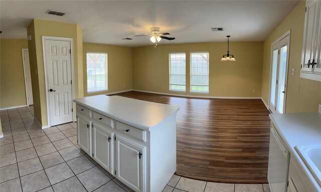 804 Austin Acre, Sulphur Springs, TX 75482 - kitchen featuring a ceiling fan, white cabinetry, light countertops, and light tile patterned floors
