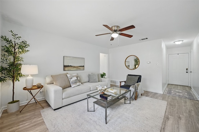 629 Chambers St, Denton, TX 76205 - living room featuring light wood-style flooring, baseboards, and ceiling fan