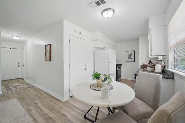 629 Chambers St, Denton, TX 76205 - dining space with light wood-type flooring and baseboards