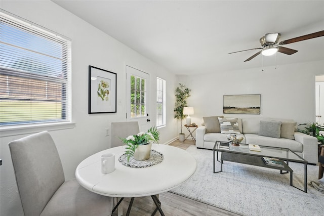 629 Chambers St, Denton, TX 76205 - living room featuring light wood-type flooring, ceiling fan, and baseboards