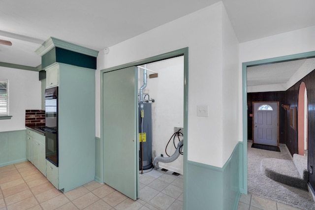 510 Allen Ave, Duncanville, TX 75137 - kitchen featuring gas water heater and light tile patterned flooring