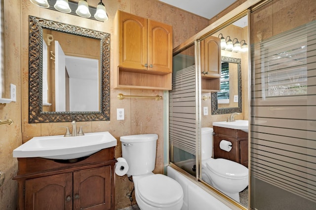 510 Allen Ave, Duncanville, TX 75137 - full bathroom with toilet, vanity, wallpapered walls, and enclosed tub / shower combo