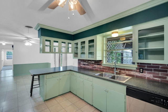 510 Allen Ave, Duncanville, TX 75137 - kitchen with stainless steel dishwasher, a sink, a ceiling fan, a peninsula, and backsplash