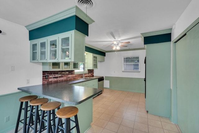 510 Allen Ave, Duncanville, TX 75137 - kitchen featuring a sink, stainless steel dishwasher, dark countertops, backsplash, and a peninsula