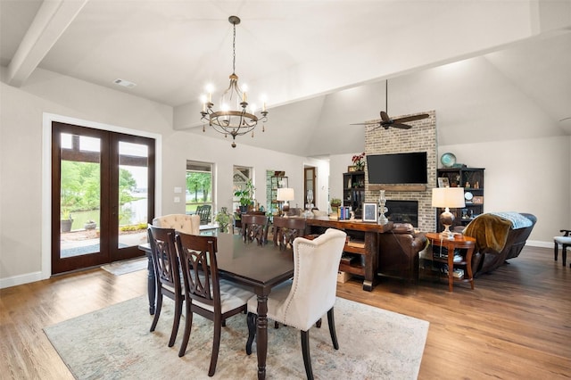 422 Sundance, Corsicana, TX 75109 - dining space with wood finished floors, french doors, a fireplace, a ceiling fan, and baseboards