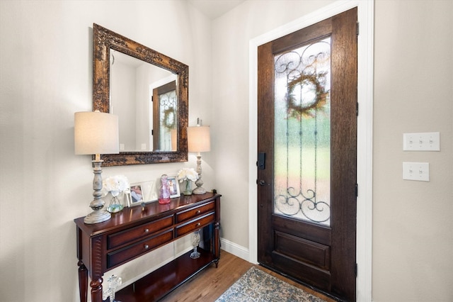 422 Sundance, Corsicana, TX 75109 - foyer with wood finished floors, baseboards, and plenty of natural light