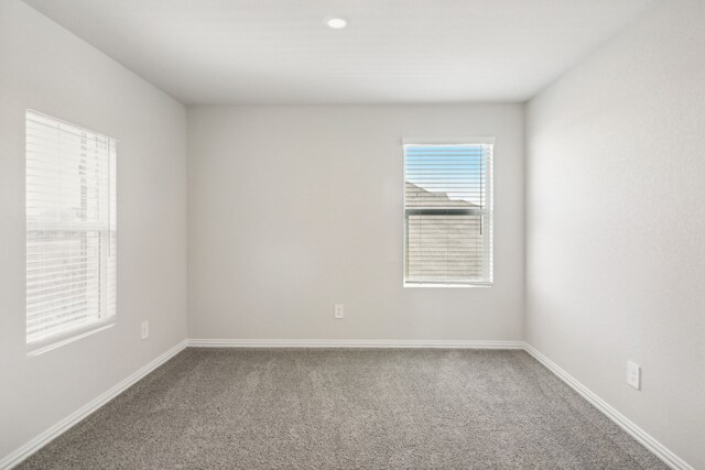 418 Stagg St, Mckinney, TX 75069 - carpeted spare room with baseboards