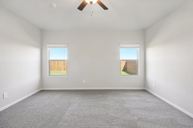 418 Stagg St, Mckinney, TX 75069 - carpeted spare room with a ceiling fan, baseboards, and a smoke detector