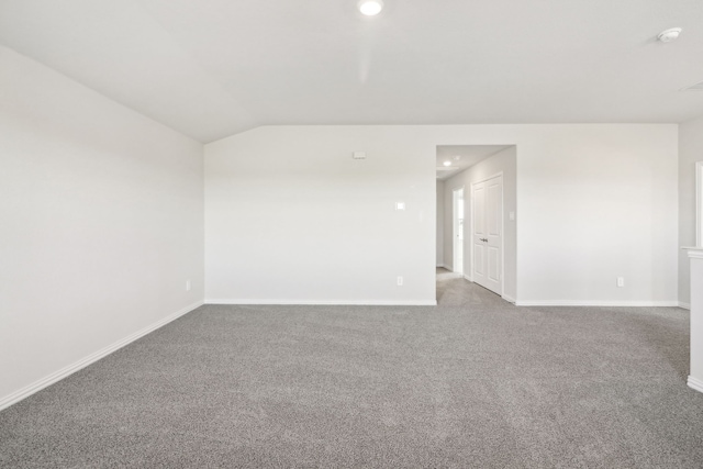 418 Stagg St, Mckinney, TX 75069 - unfurnished room with baseboards, carpet flooring, lofted ceiling, recessed lighting, and a smoke detector