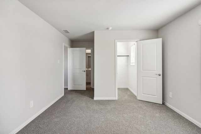418 Stagg St, Mckinney, TX 75069 - unfurnished bedroom with carpet floors, a walk in closet, baseboards, and a closet
