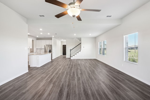 418 Stagg St, Mckinney, TX 75069 - unfurnished living room featuring dark wood-style floors, baseboards, a sink, stairway, and recessed lighting