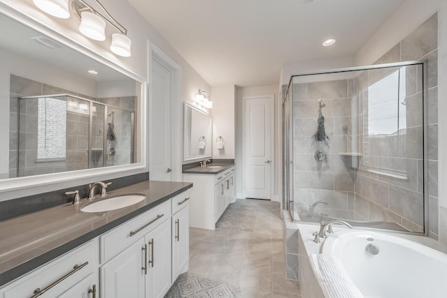 3723 Birch Wood Ct, Northlake, TX 76226 - bathroom featuring a shower stall, a bath, two vanities, tile patterned flooring, and recessed lighting