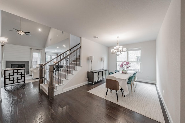 3723 Birch Wood Ct, Northlake, TX 76226 - dining space featuring baseboards, wood finished floors, ceiling fan, a glass covered fireplace, and stairs