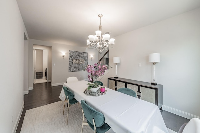 3723 Birch Wood Ct, Northlake, TX 76226 - dining space with a chandelier, wood finished floors, and baseboards