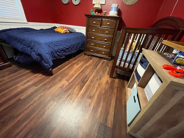 4054 Lakeshore Dr, Lone Star, TX 75668 - bedroom with dark wood-style flooring and wainscoting