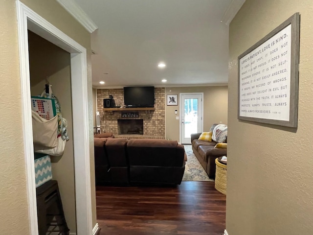 4054 Lakeshore Dr, Lone Star, TX 75668 - living area featuring crown molding, wood finished floors, a brick fireplace, and recessed lighting