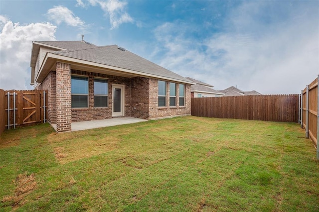 1683 Timpson Dr, Forney, TX 75126 - rear view of house featuring a patio, brick siding, and a shingled roof