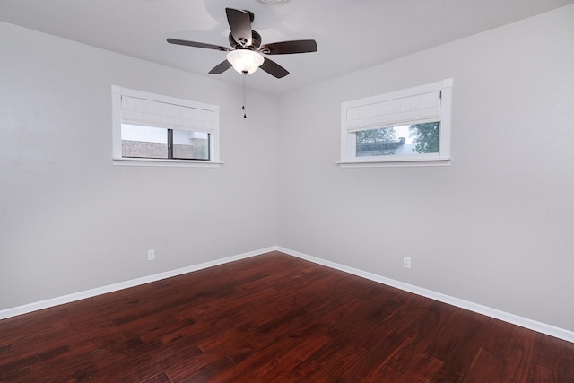 2103 S High St, Brady, TX 76825 - spare room with plenty of natural light, baseboards, and wood finished floors