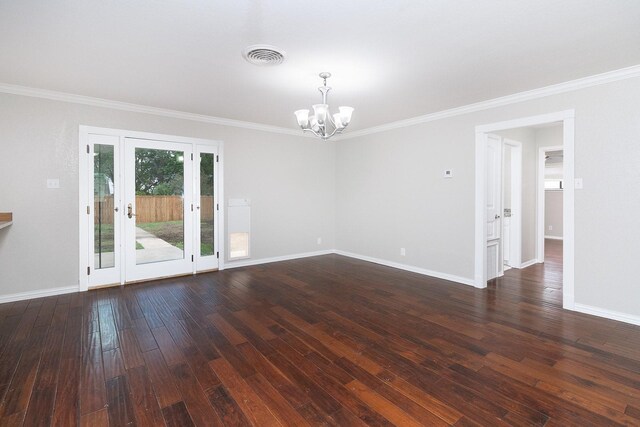 2103 S High St, Brady, TX 76825 - unfurnished room with a chandelier, baseboards, dark wood-type flooring, and ornamental molding