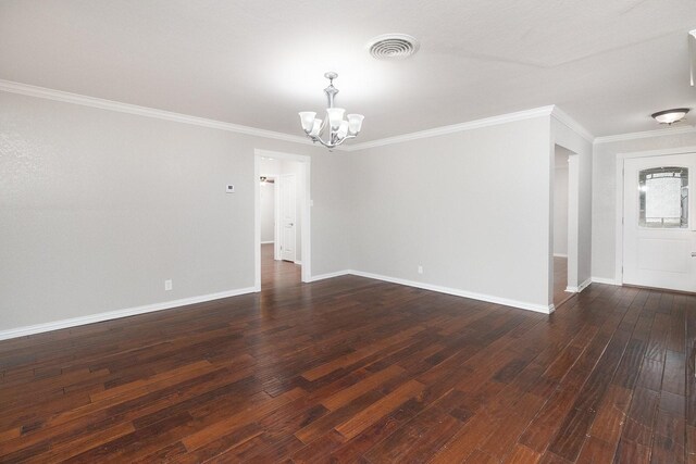 2103 S High St, Brady, TX 76825 - unfurnished room with a chandelier, dark wood-style floors, baseboards, and ornamental molding