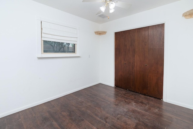 2103 S High St, Brady, TX 76825 - unfurnished bedroom featuring a closet, wood finished floors, baseboards, and a ceiling fan