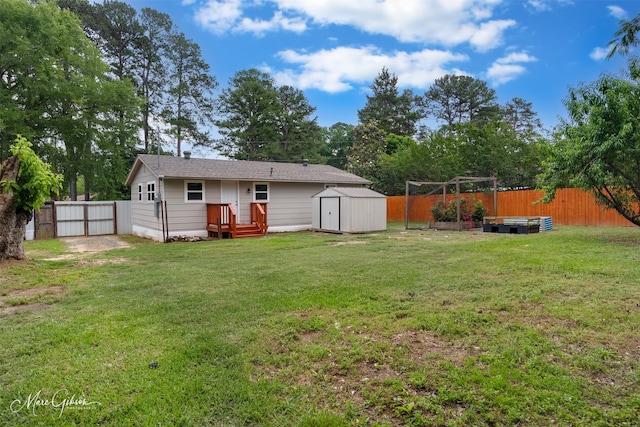 6470 Faust Dr, Shreveport, LA 71129 - back of property featuring a storage shed, an outbuilding, and a gate