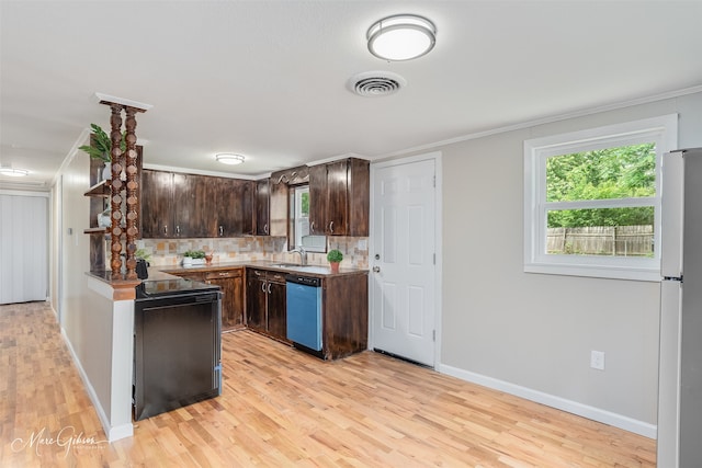 6470 Faust Dr, Shreveport, LA 71129 - kitchen with dishwashing machine, dark brown cabinetry, light wood-style flooring, a sink, and freestanding refrigerator