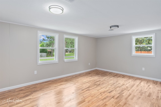 6470 Faust Dr, Shreveport, LA 71129 - unfurnished room with light wood-type flooring, baseboards, and crown molding